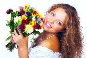 A woman having flowers in hands